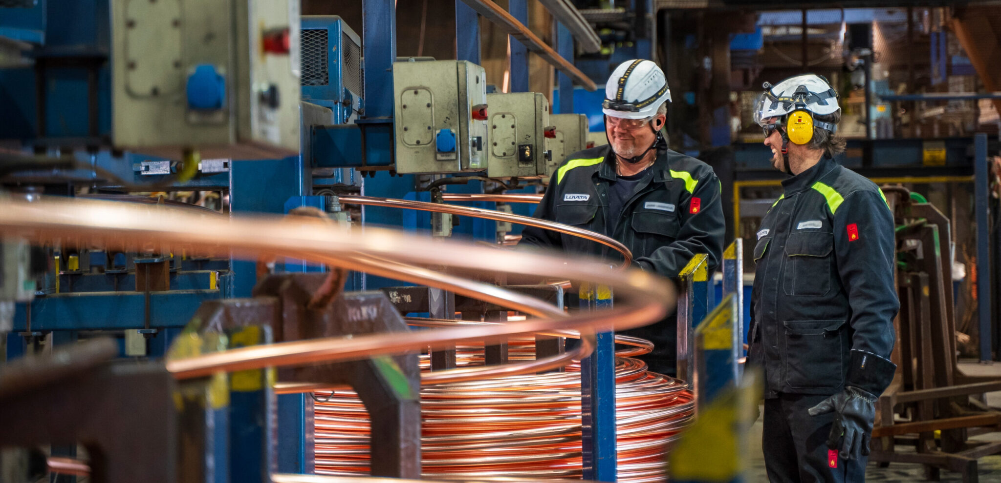 Two Luvata employees in a factory setting