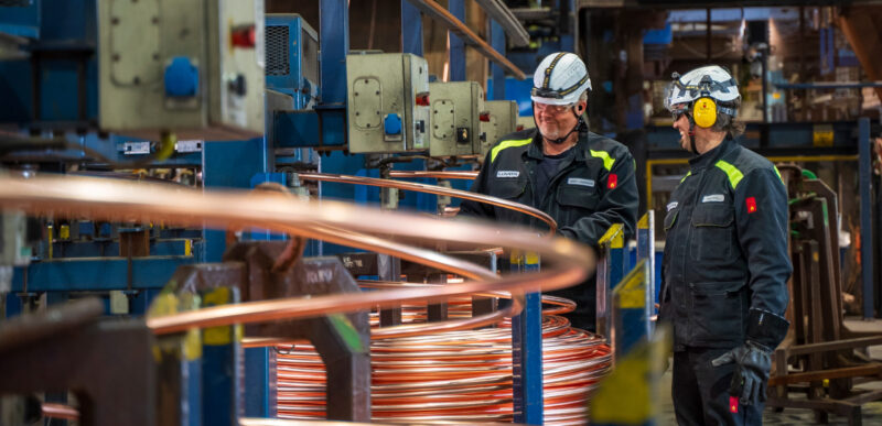 Two Luvata employees in a factory setting